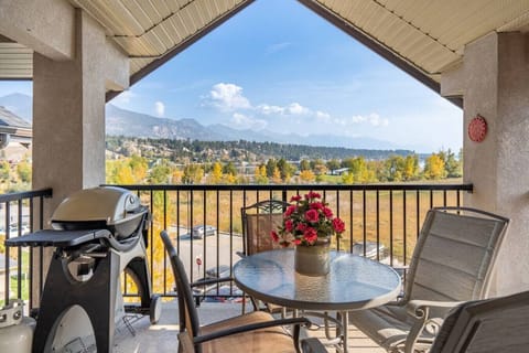 Private, top-floor balcony with outdoor seating, a BBQ (propane provided) and mountain views.