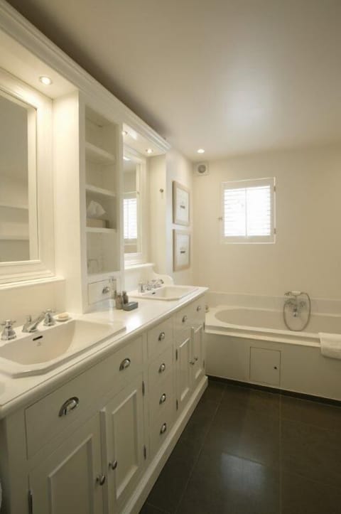 Junior Suite | Bathroom | Rainfall showerhead, hair dryer, slippers, towels