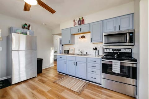 - Spacious kitchen with stainless steel fridge   - Bright backsplash and stylish cabinetry   - Fully stocked for extended stay cooking needs  