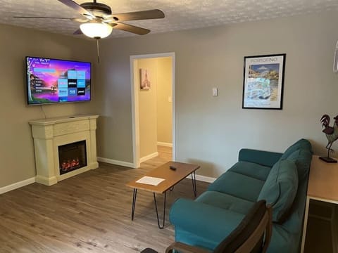 Living room with 50 inch tv and fireplace