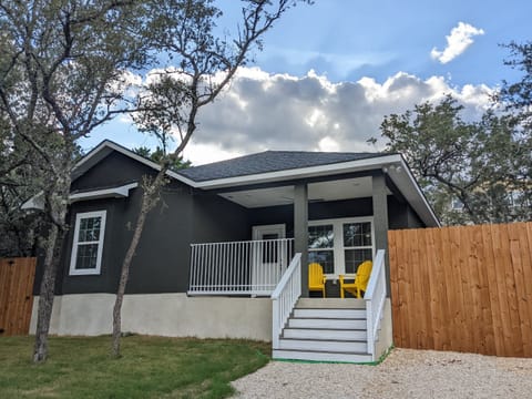 The front has a cozy porch for sitting and watching the wildlife that wanders by