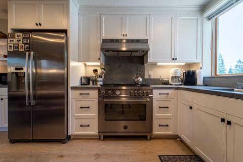 Chef's kitchen: fridge w/ ice maker, Smeg coffee maker & Bertazzoni gas range