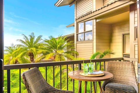 Lounge on your shaded lanai with lush tropical landscaping just beyond the railing.