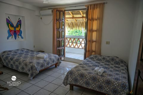 Superior Quadruple Room, 2 Queen Beds, Partial Ocean View, Beachside | Iron/ironing board, free WiFi, bed sheets
