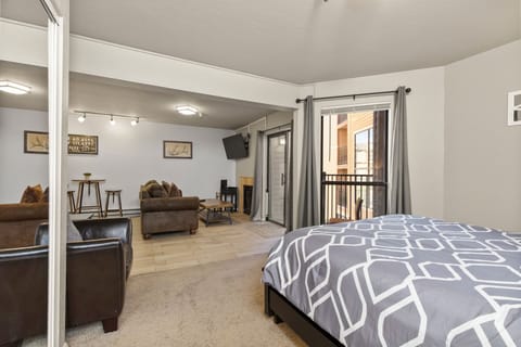 Your open-concept studio offers a welcoming retreat where comfort meets convenience. Relax on plush seating, enjoy mountain views from your private balcony, and unwind in a cozy space designed for memorable stays.