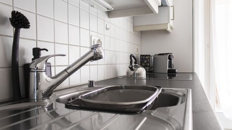 Family Apartment (04 - Giove) | Private kitchen | Full-size fridge, microwave, oven, stovetop