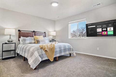 Master bedroom features a Massive king bed and smart TV.