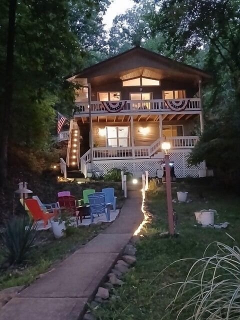 Rear  view yard facing the lake with newly expanded firepit conversation area. 