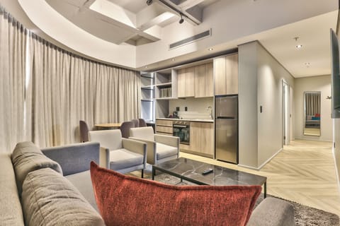 Apartment, 2 Bedrooms | Living room | Flat-screen TV