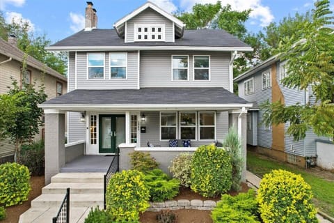 Frontal view of property | sleek gray and white exterior façade exudes contemporary sophistication