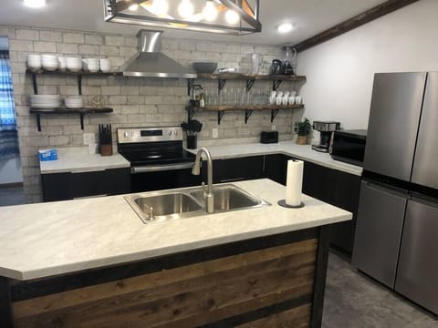 Open shelves in a well stocked Kitchen
