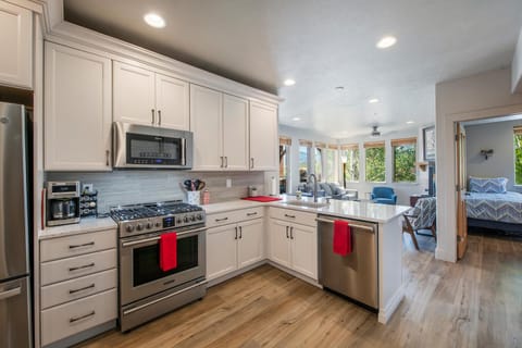 Upgraded kitchen with new stainless steel appliances and cabinetry
