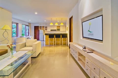 Deluxe Room, River View | Living room | LCD TV