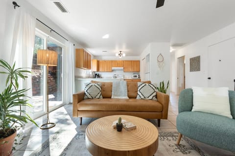 Brightly-lit living space with a full kitchen!