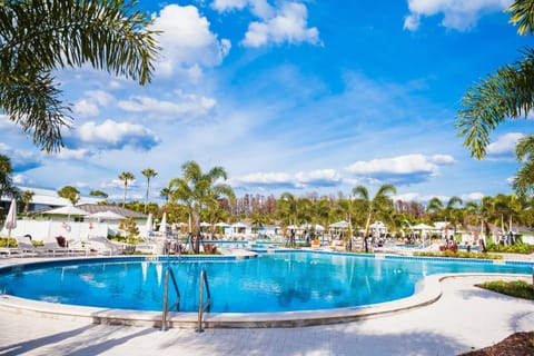 Experience Saddlebrook’s expansive resort-style pool surrounded by lush palms, spacious sun decks, and private cabanas.