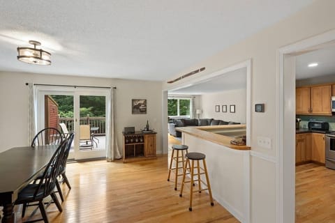 Open floorplan main living area with walk out balcony with propane grill.