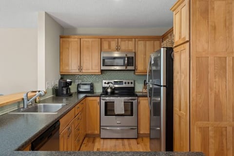 Updated kitchen with stainless steel appliances.