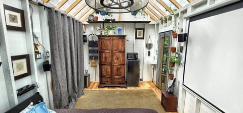 Table and bench's drawn up with Sliding glass window curtains pulled.
