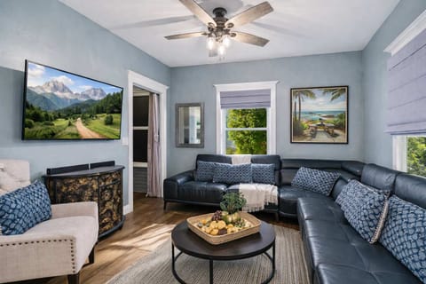 Cozy Living Room with Large Sectional Sofa, Natural Light, Soft Coastal Colors & Relaxed Comfortable Seating Area