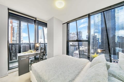 The Master bedroom with a queen sized bed & city views.