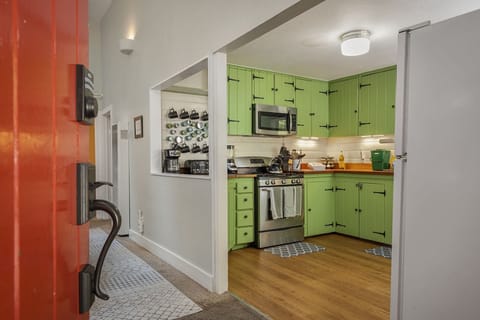 The entry and living room open to the kitchen.