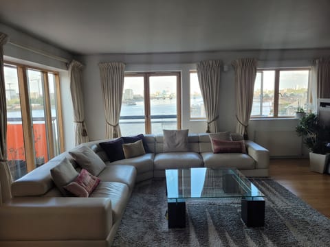 Huge open plan living room - views of the river from all windows 