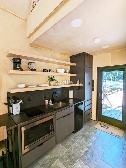 View of the kitchen from the living room. We provide everything needed to dine in