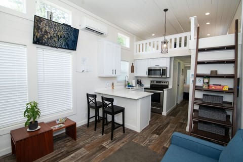 Full  kitchen, featuring stainless steel appliances.