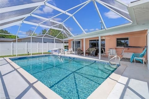 An abundance of sunshine and space to layout by the pool with screen protection.