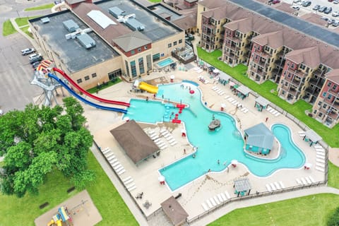 6 free daily passes to the indoor and outdoor waterpark. Hot tub, slides, bar. 