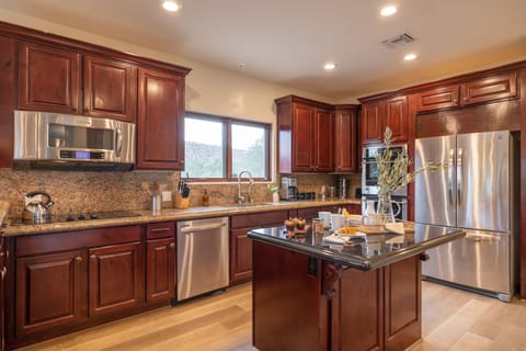 Large kitchen with modern appliances.