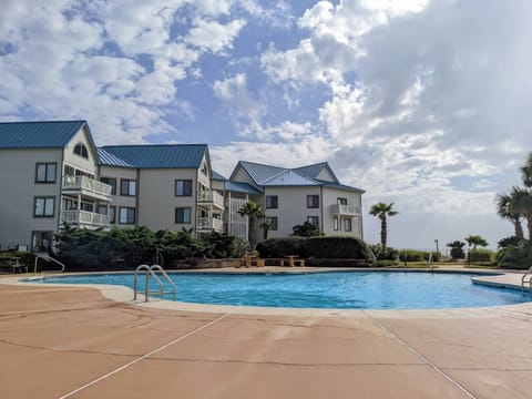 Beautiful courtyard pool just steps from the beach.