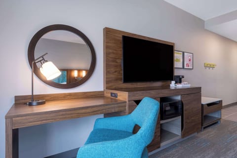 Hypo-allergenic bedding, desk, laptop workspace, blackout drapes