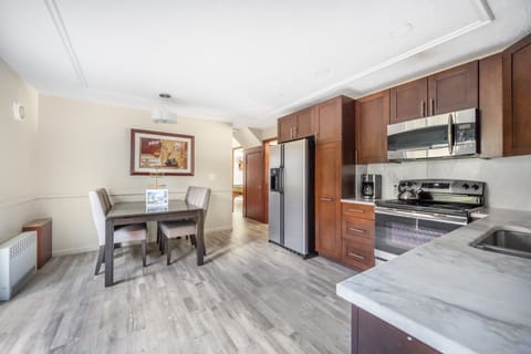 Fully equipped kitchen and cozy dining area for easy meals and gatherings.