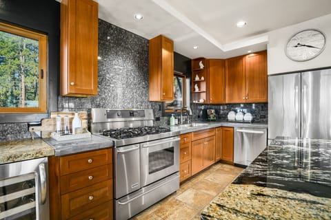 Main House - Kitchen fully stocked with cookware and dishware.
