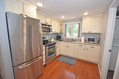 The kitchen with a Keurig/drip coffee pot combo. 