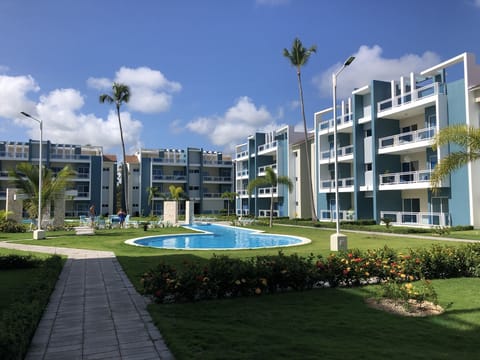 property with Pool, outdoor grilling and seating area, showers and bathrooms