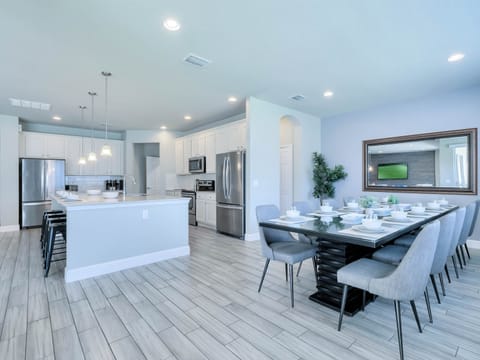 - Large dining space with seating for family groups  
- Vacation rental with modern kitchen and dining area  
- Perfect for group meals near Orlando attractions