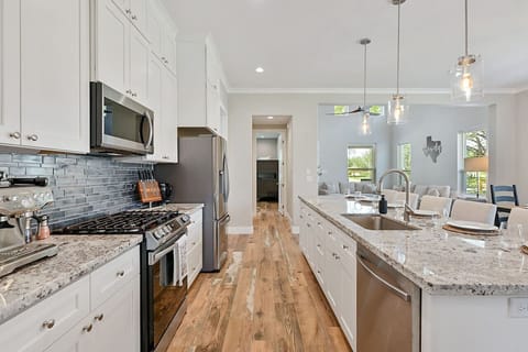 Kitchen equipped with a sleek espresso machine for coffee enthusiasts.