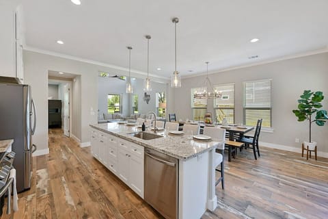 Abundant counter space enhances functionality in the beautifully designed kitchen.