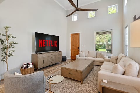 Spacious living room, abundant seating for comfort and socializing.