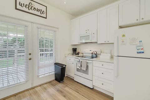 Kitchen, view of the back yard and extremely well appointed for all of your cooking needs.