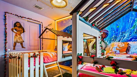 Tropical Moana-themed kids’ room with bunk beds and ocean adventure vibes.