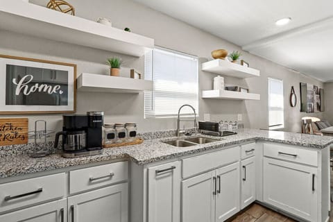 kitchencoffee makerWhite cabinetsWindow