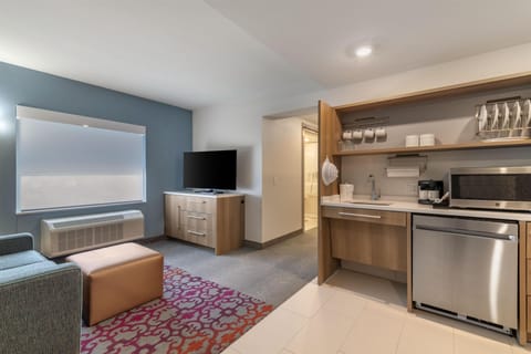 Suite, 1 Bedroom | Living area | TV
