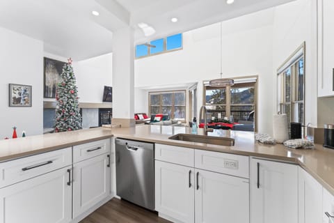 Full kitchen with stainless steel appliances.