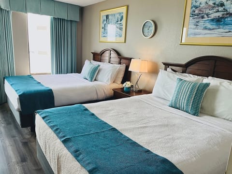Retreat to an oceanfront haven, where the charm of the beds meets the allure of the sea, providing a delightful setting for a rejuvenating stay.