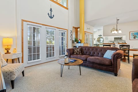 Living area with cathedral ceilings; convenient to dining area