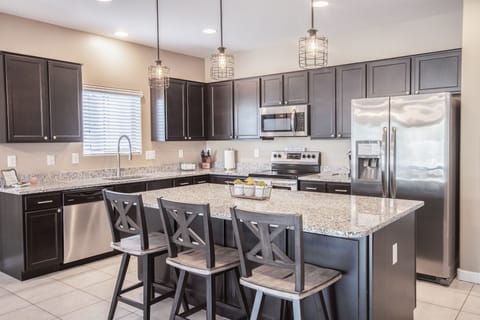 Large kitchen, SS appliances, fully stocked and granite countertops