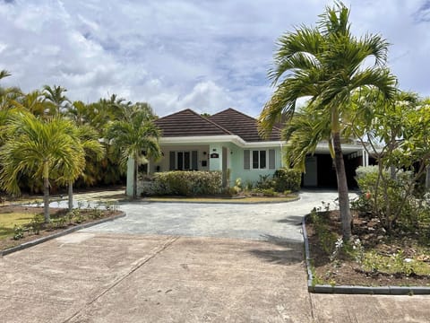 GiGi Villa view from the private street in the Palms Community. 
